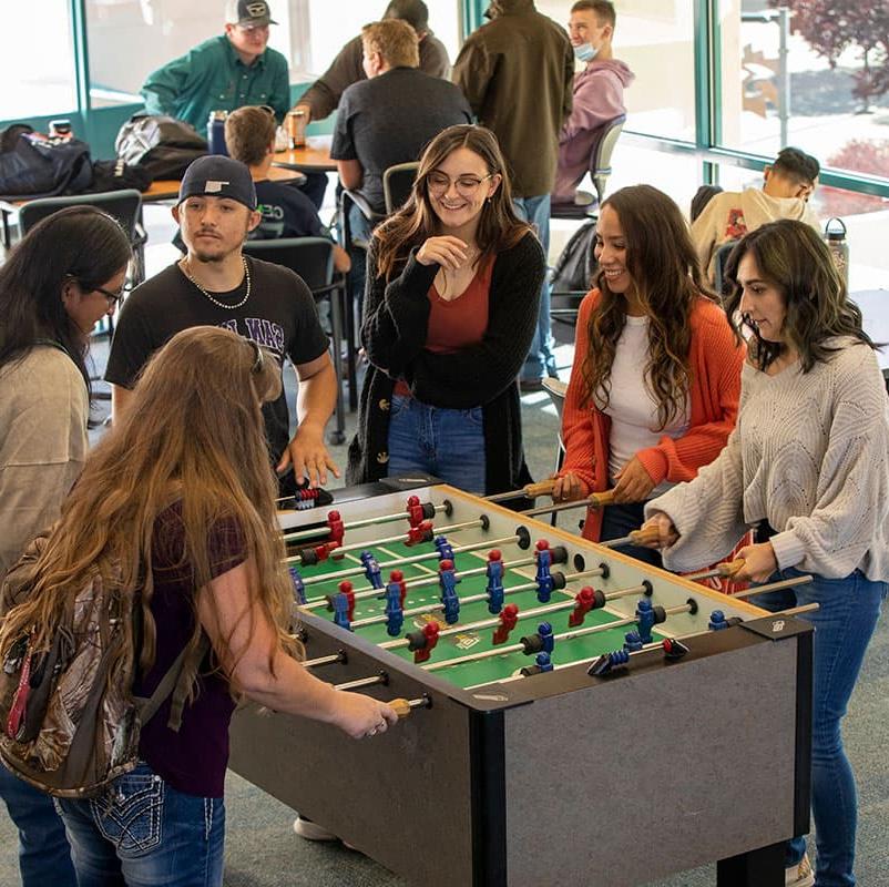 太阳集团娱乐场登陆网站 students playing foosball in the Suns Student Lounge.